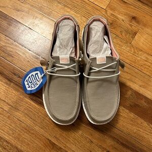 Women’s size 9 Hey Dudes, new with tags. Color tan/gray/khaki